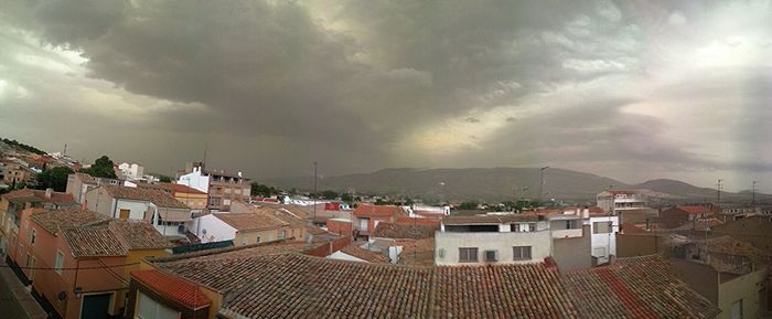 High angle view of town against cloudy sky