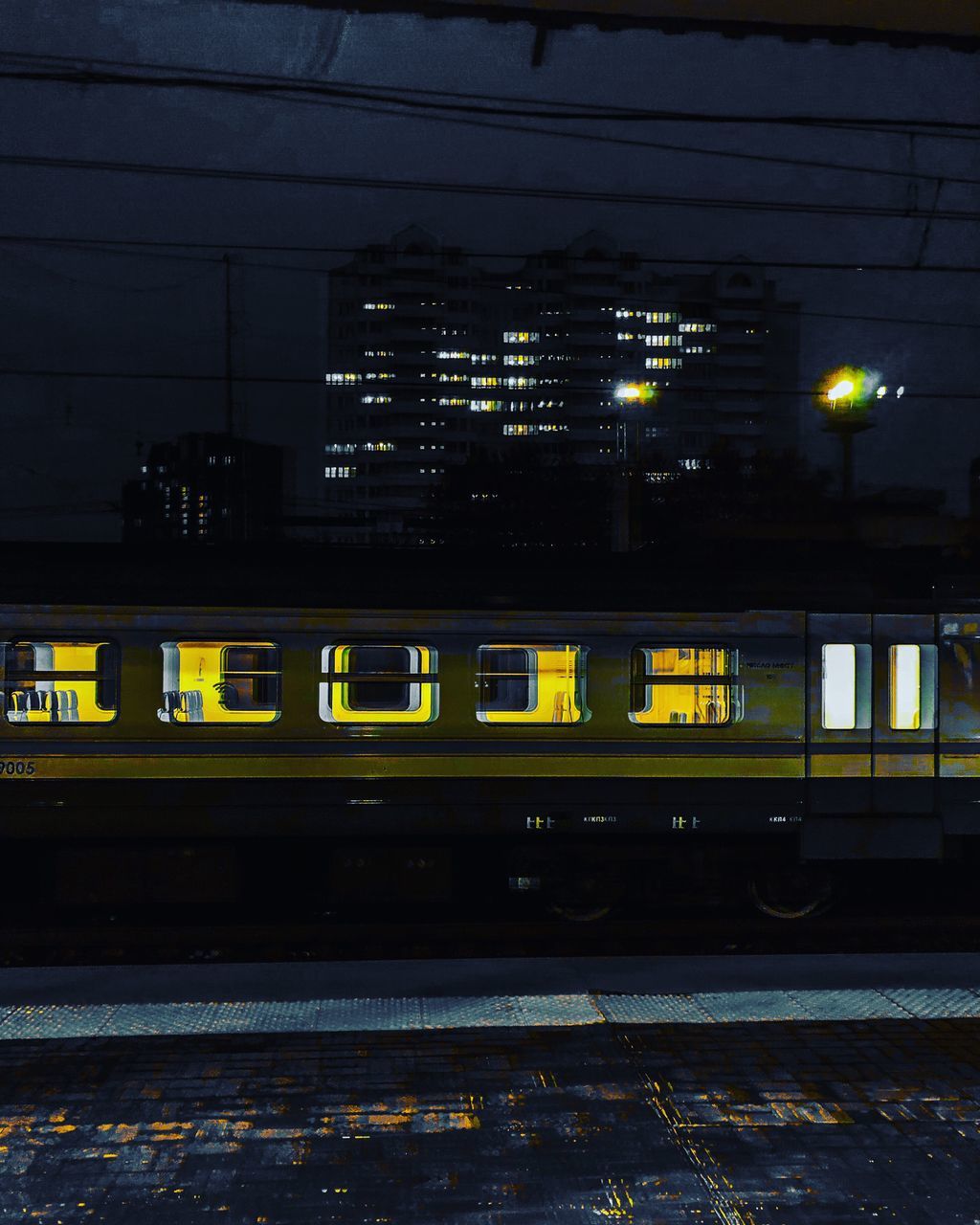 TRAIN ON RAILROAD STATION PLATFORM