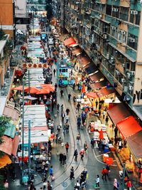 High angle view of people walking on road in city