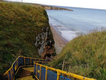 High angle view of sea shore against sky
