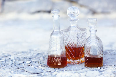 Close-up of wine bottles on table