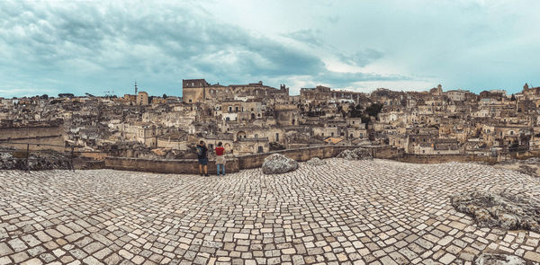 View of buildings in town against sky