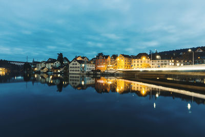 Reflection of city in water at night