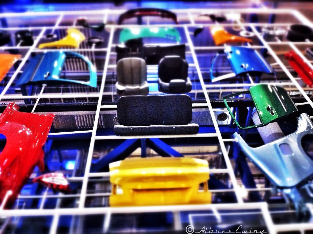 blue, in a row, indoors, variation, selective focus, large group of objects, focus on foreground, multi colored, childhood, abundance, close-up, order, side by side, still life, metal, choice, day, transportation, group of objects, yellow