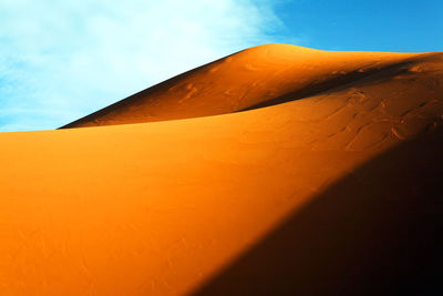 Scenic view of sand dunes at erg chebbi desert against sky