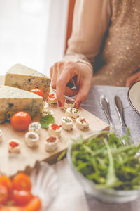 Woman taking cheese 