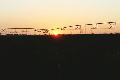 Scenic view of silhouette landscape against clear sky during sunset