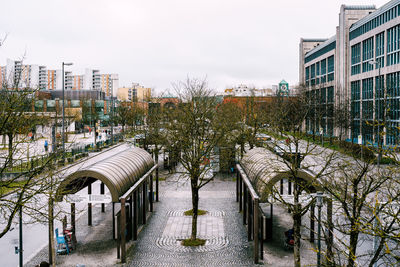 Canal amidst buildings against sky in city