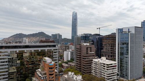 Buildings in city against sky