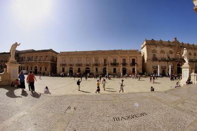 Group of people in front of historical building