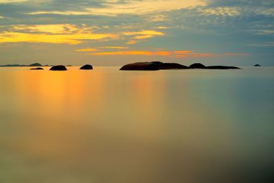 Scenic shot of calm sea at sunset