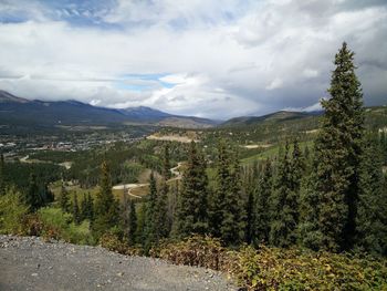 Scenic view of mountains against cloudy sky