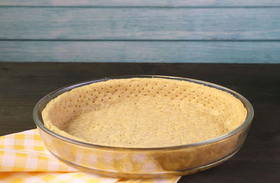 Pie crust in baking dish ready for baking pumpkin pie