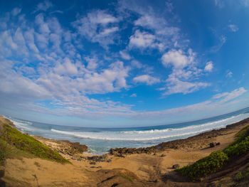 Scenic view of beach against sky