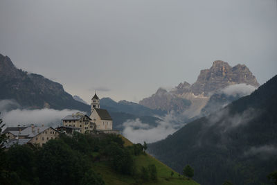 Panoramic view of building and mountains against sky