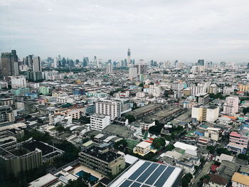 High angle view of buildings in city against sky