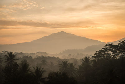 Scenic view of mountains against sky during sunset