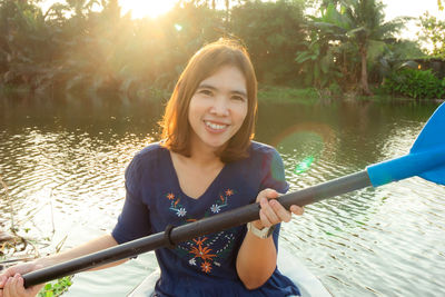 Portrait of young woman in boat