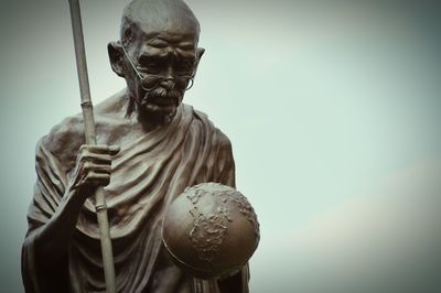 Low angle view of statue against sky