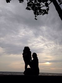 Silhouette of couple on beach