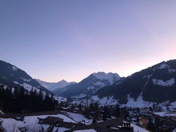 Scenic view of mountains against clear sky during winter