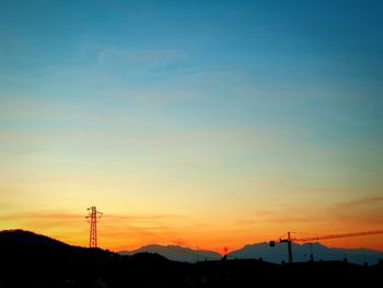 Silhouette mountain against sky during sunset