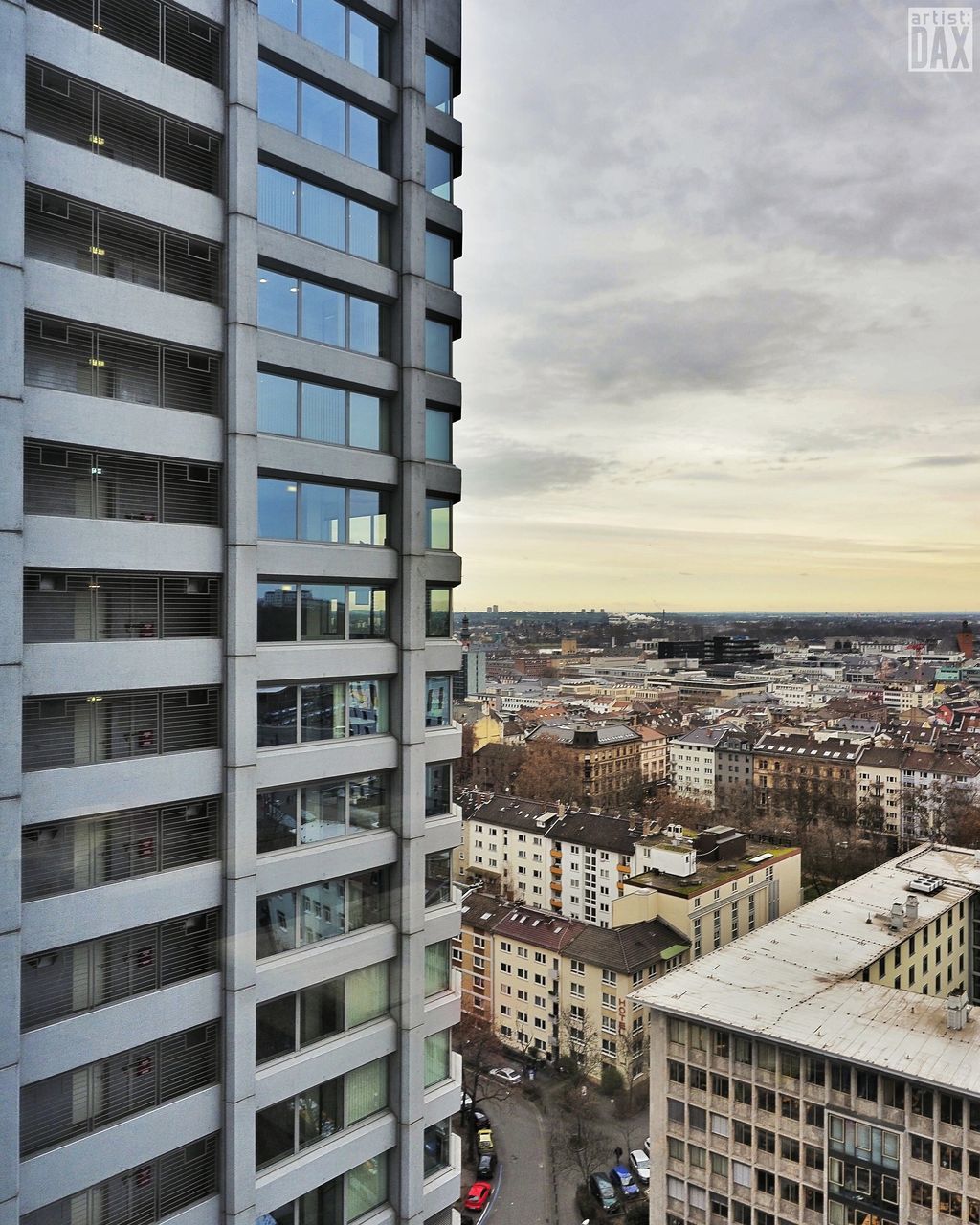 building exterior, architecture, city, built structure, cityscape, sky, skyscraper, office building, city life, tall - high, modern, tower, residential building, crowded, residential structure, residential district, cloud - sky, building, high angle view, sunset