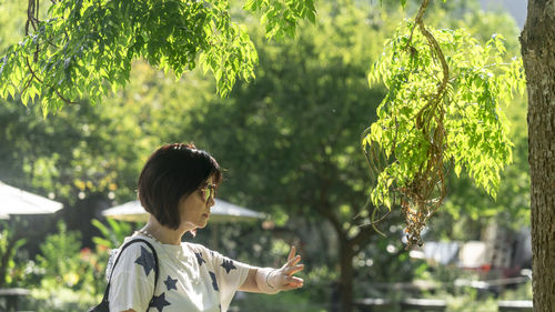 Rear view of woman on plants