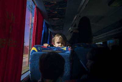 Portrait of boy traveling in bus