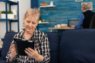 Mid adult woman using mobile phone