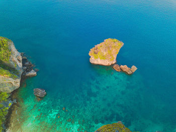 High angle view of rock formation in sea