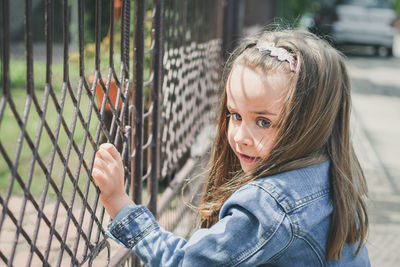 Portrait of girl standing outdoors