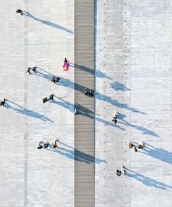 High angle view of people walking on floor
