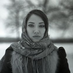 Portrait of woman standing against snow