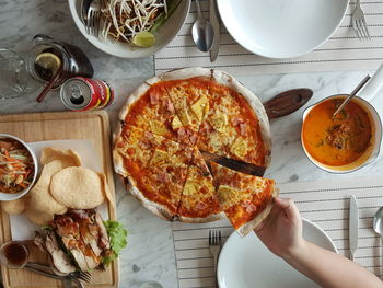 High angle view of person preparing food on table