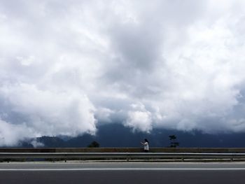 Road against cloudy sky