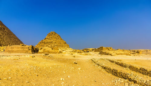 Built structure on land against clear blue sky