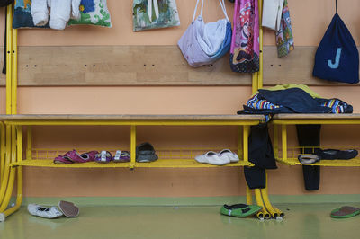 Shoes on racks in room