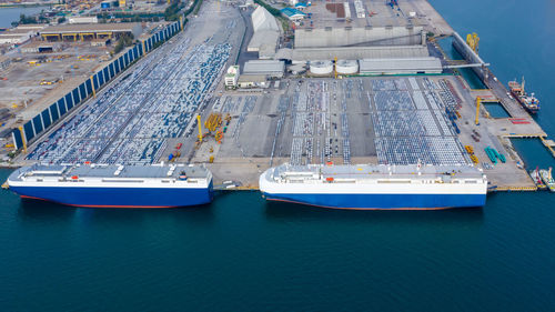 Aerial view car loading to large roro roll on off carrier vessel for shipping to worldwide.