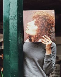 Young woman touching hair