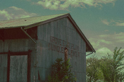 Low angle view of abandoned building against sky