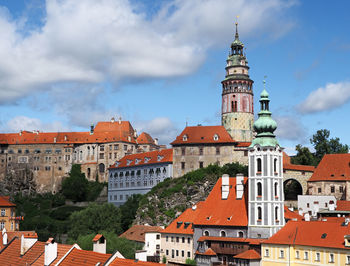 Buildings in town against sky