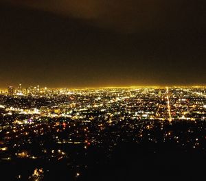 Aerial view of illuminated cityscape at night