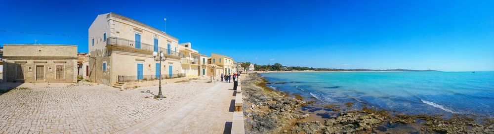 View of sea against clear blue sky