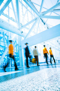 People walking in modern office building