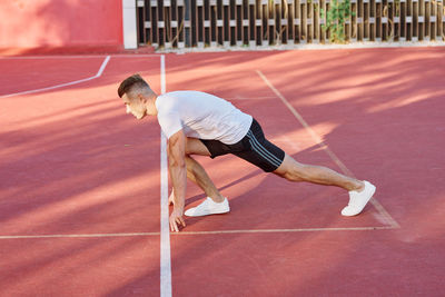 Male runner getting ready