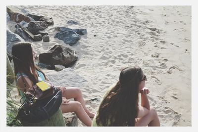 Tourists sitting on bench