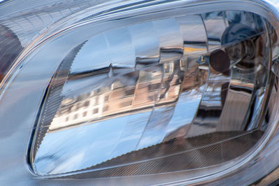 Reflection of car on side-view mirror