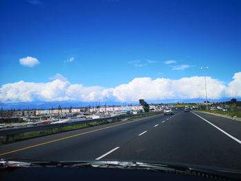 Road in city against sky