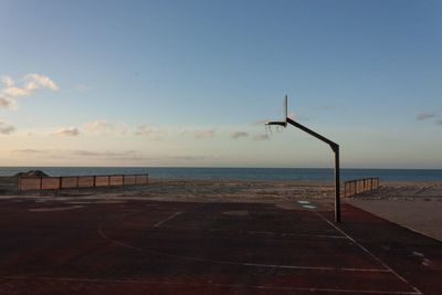 Scenic view of basketball court at sea against sky